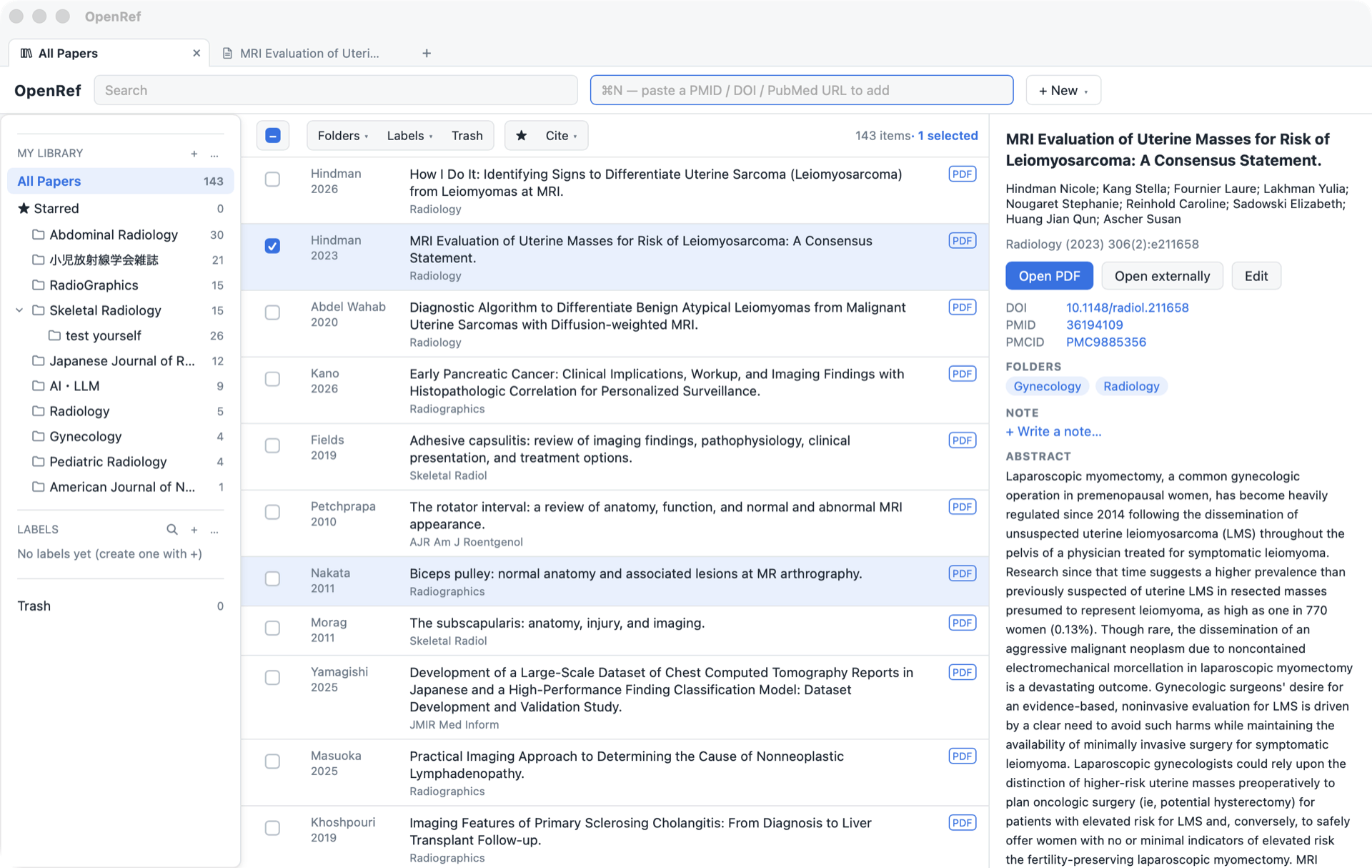 OpenRef with a real library: folders and labels on the left, the paper list in the middle (143 items, one selected), and the selected paper's details and abstract on the right; the tab bar shows the list and an open PDF